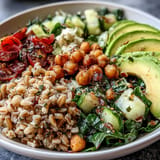 Nourishing Ancient Grains Bowl with fluffy farro, quinoa, and vibrant veggies.